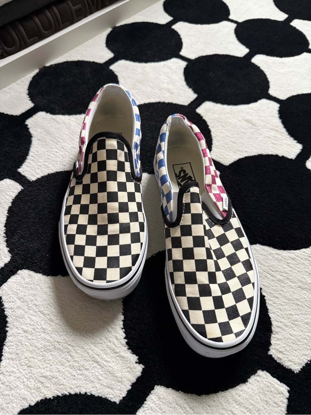 Vans Checkerboard Slip-On Sneakers in Black & White with Blue and Pink Accents